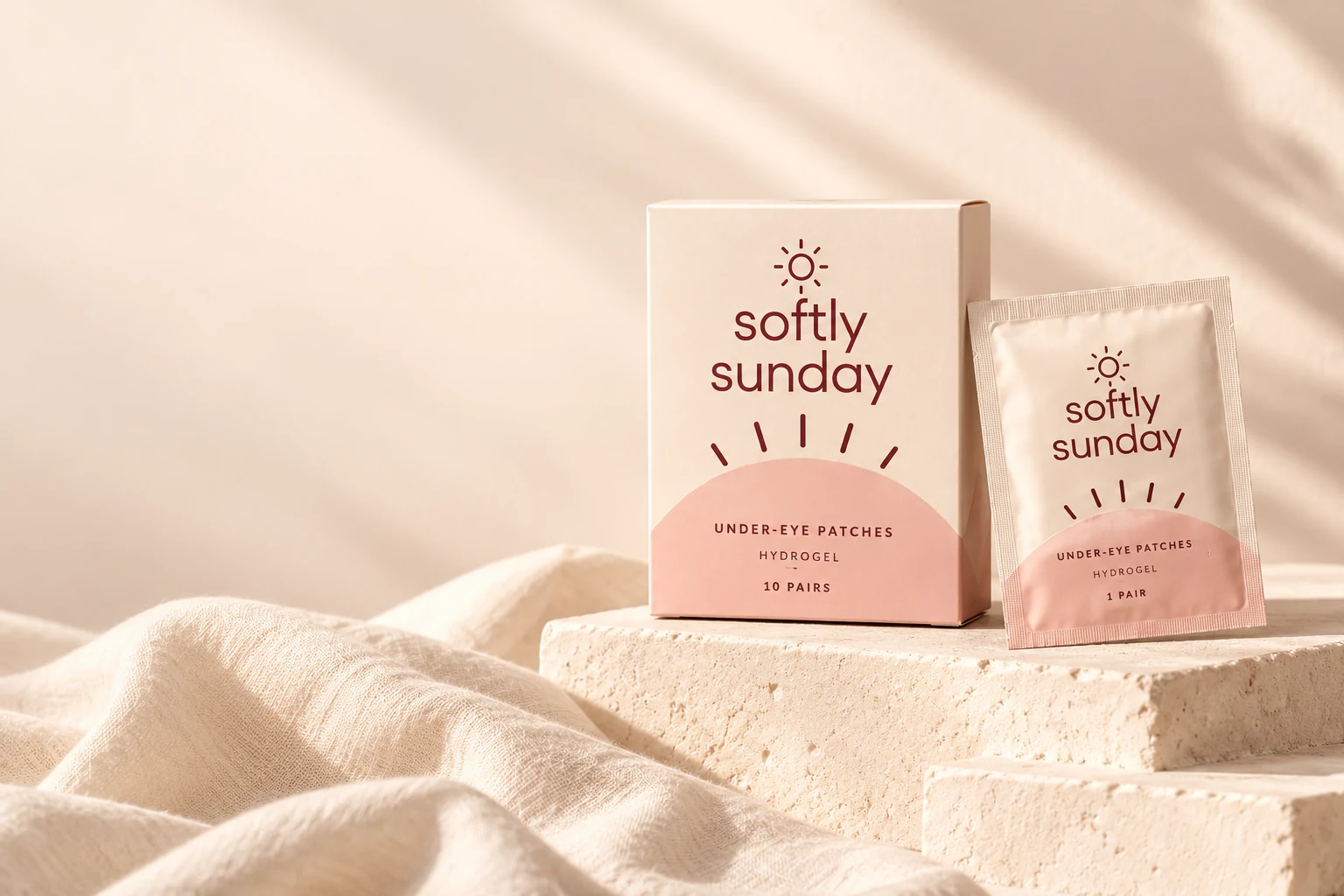 softly sunday cream and blush under-eye patch carton and sachet in warm morning light